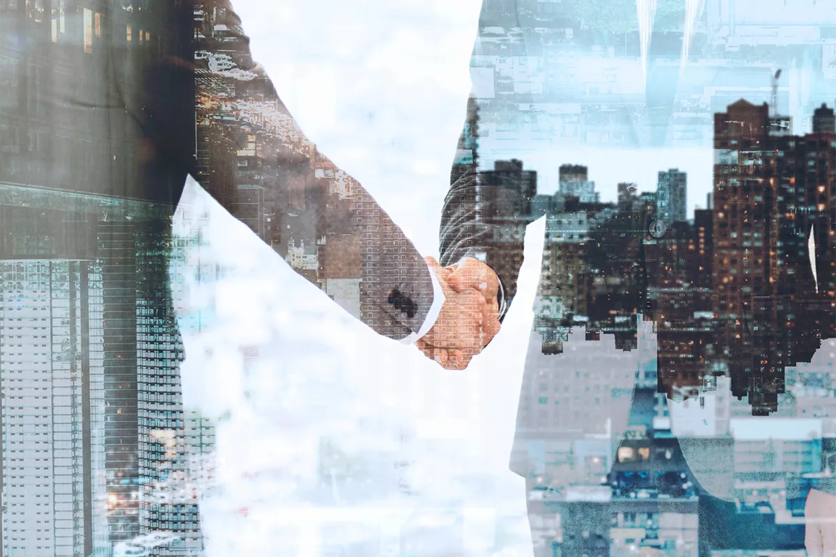 Two business men shaking hands